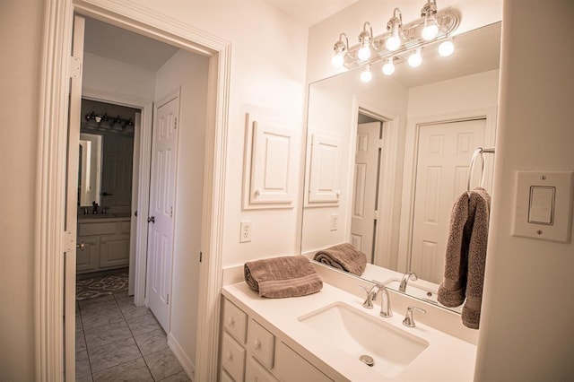 bathroom with marble finish floor and vanity