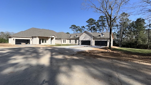 view of front facade with an attached garage and driveway