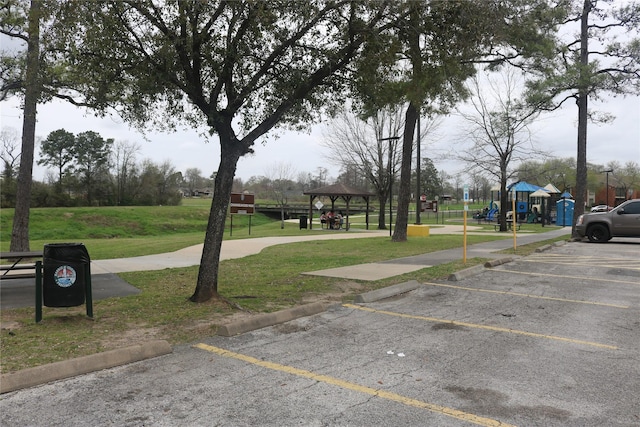 uncovered parking lot featuring a gazebo and playground community