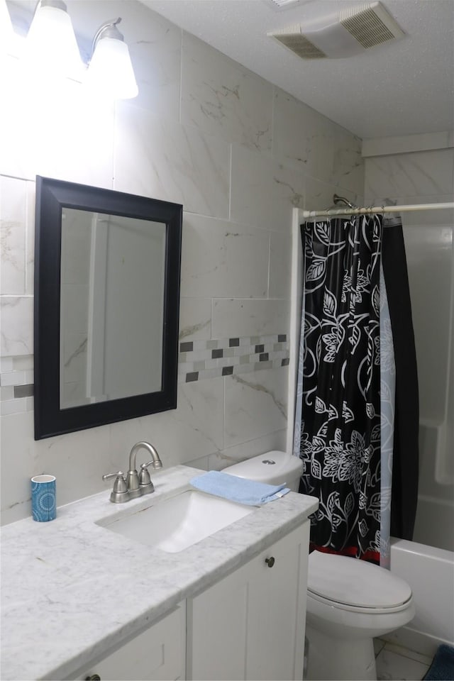 full bathroom with visible vents, toilet, shower / bath combination with curtain, vanity, and marble finish floor