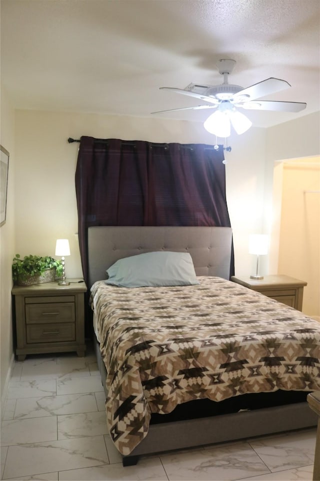 bedroom with baseboards, marble finish floor, and ceiling fan