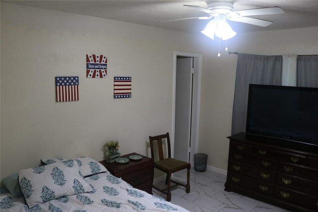 bedroom with marble finish floor, baseboards, and a ceiling fan