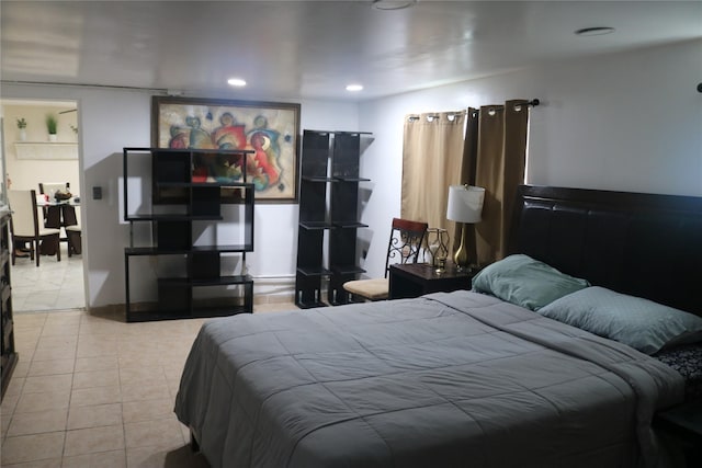 bedroom featuring tile patterned flooring and recessed lighting