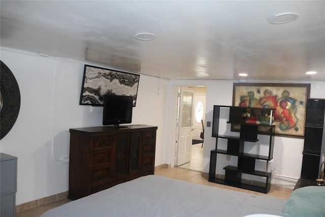 bedroom with tile patterned floors, recessed lighting, and baseboards