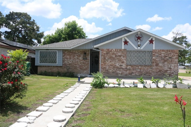 14902 Woodford St, Channelview, TX 77530 - view of front of property with brick siding and a front yard