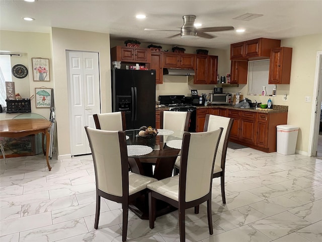 14902 Woodford St, Channelview, TX 77530 - dining space featuring light marble finish floors, ceiling fan, recessed lighting, and baseboards