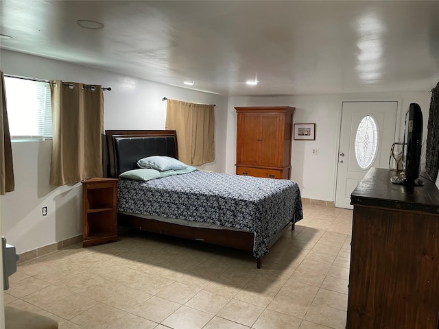 14902 Woodford St, Channelview, TX 77530 - bedroom featuring light tile patterned floors, multiple windows, recessed lighting, and baseboards