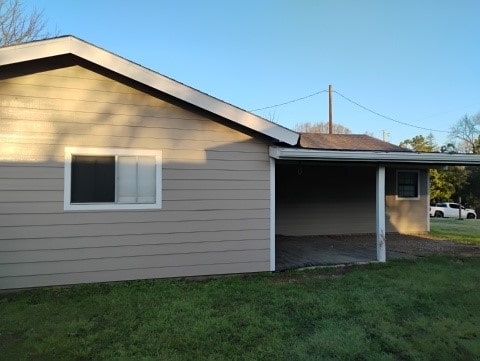 view of side of property with a yard