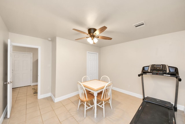 dining space featuring light tile patterned floors, visible vents, ceiling fan, and baseboards