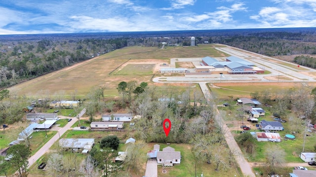 drone / aerial view featuring a forest view