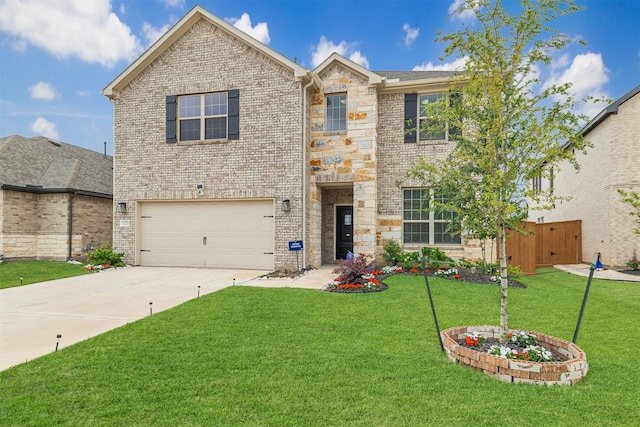 traditional-style home with brick siding, an attached garage, concrete driveway, and a front yard