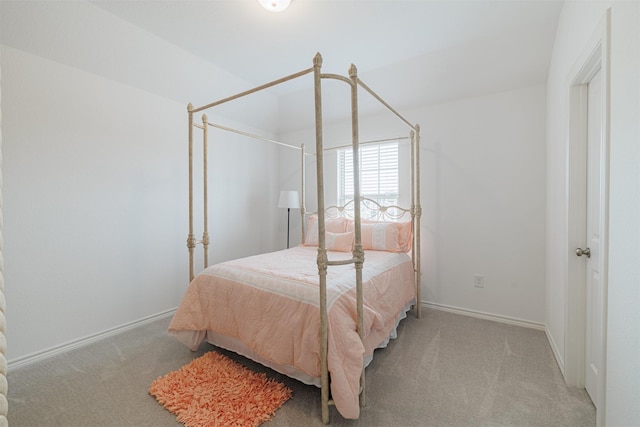 carpeted bedroom with baseboards