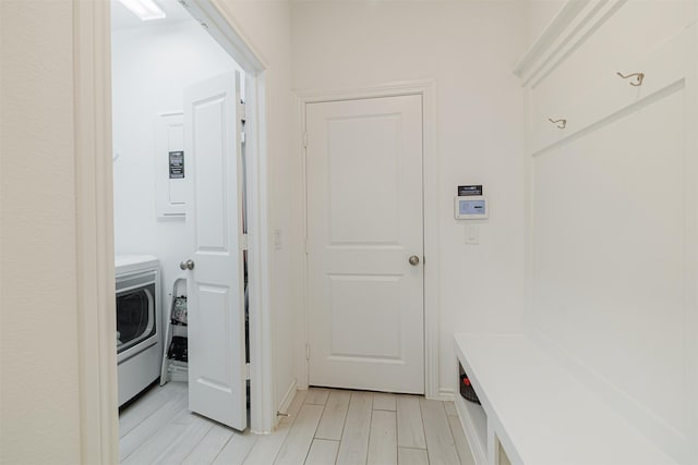 laundry room with washer / dryer and light wood-style floors