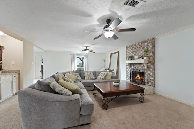 living room with visible vents, light colored carpet, a brick fireplace, and a textured ceiling