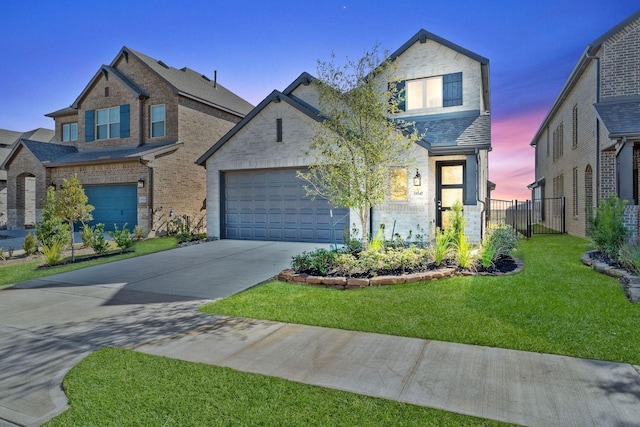 view of front of property with a front lawn, an attached garage, fence, and driveway