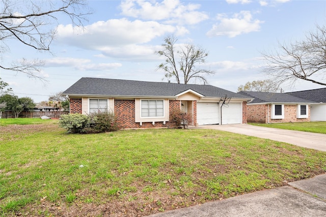 ranch-style home featuring a garage, a front yard, brick siding, and driveway