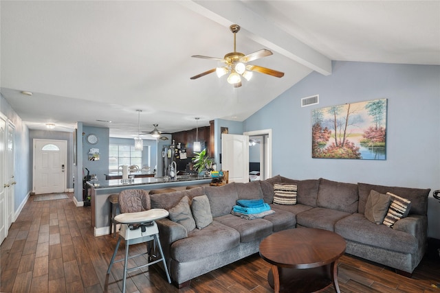 living room with visible vents, baseboards, dark wood-style floors, and vaulted ceiling with beams