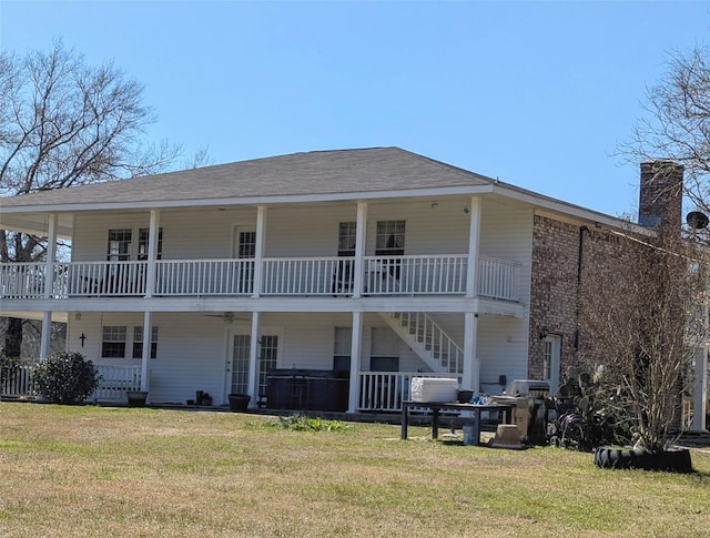 3902 Moore Cemetery Rd, Groveton, TX 75845 - rear view of house with a lawn, a chimney, and stairway