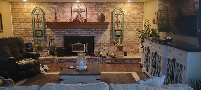 3902 Moore Cemetery Rd, Groveton, TX 75845 - living room with wood finished floors, brick wall, and recessed lighting