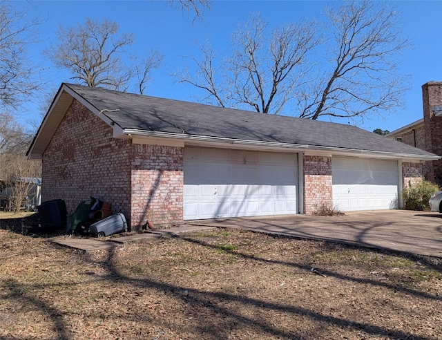 garage featuring driveway