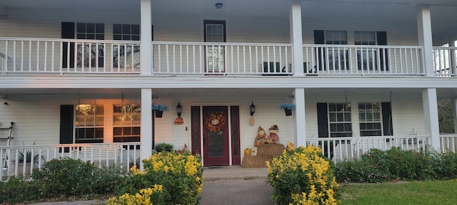 3902 Moore Cemetery Rd, Groveton, TX 75845 - view of exterior entry featuring a balcony and covered porch