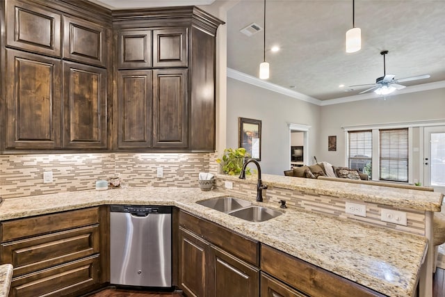 kitchen featuring visible vents, ornamental molding, a sink, stainless steel dishwasher, and decorative backsplash