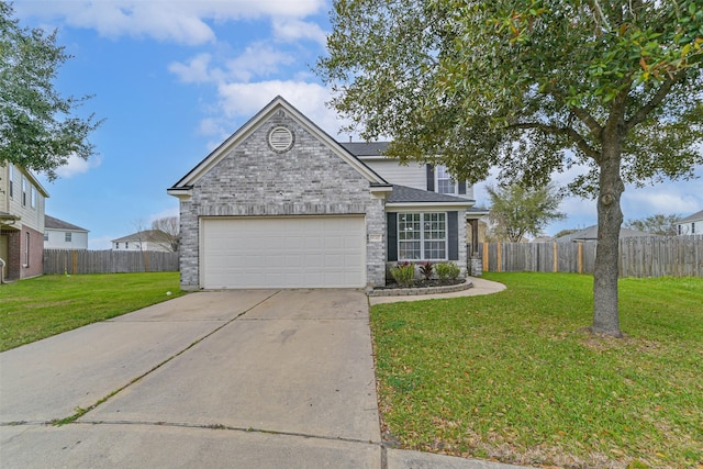 traditional-style house with brick siding, a front lawn, fence, concrete driveway, and a garage