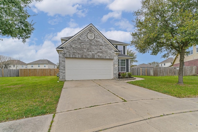 traditional-style home featuring an attached garage, concrete driveway, a front yard, and fence