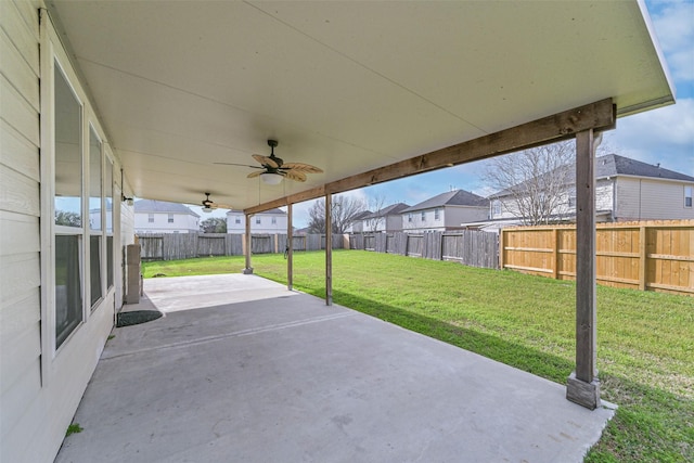 view of patio with a ceiling fan, a residential view, and a fenced backyard