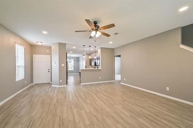 unfurnished living room with light wood finished floors, visible vents, baseboards, recessed lighting, and a ceiling fan