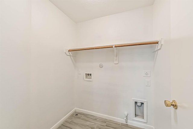 laundry area with washer hookup, hookup for a gas dryer, baseboards, hookup for an electric dryer, and laundry area