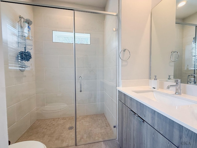 full bath with a shower stall, toilet, and vanity