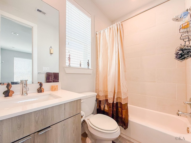 bathroom with visible vents, shower / bath combo with shower curtain, toilet, and vanity