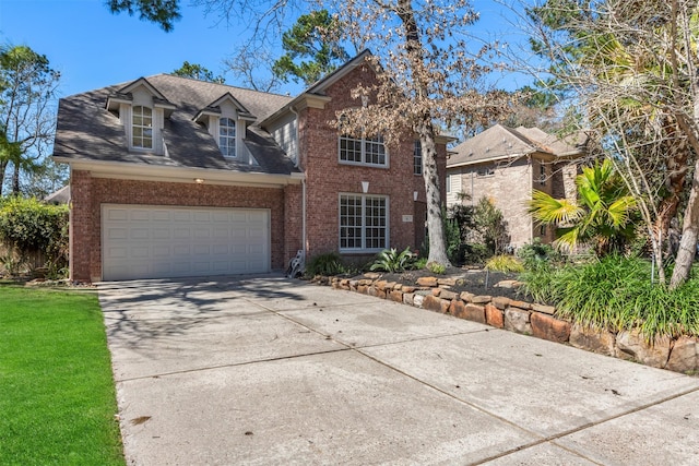 view of front facade featuring brick siding, an attached garage, concrete driveway, and a shingled roof