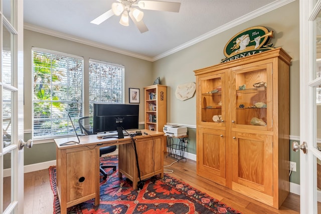 office area with crown molding, baseboards, light wood-type flooring, french doors, and a ceiling fan