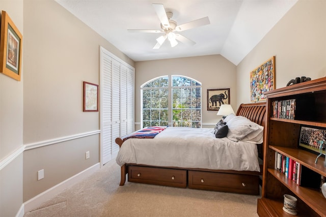 bedroom featuring baseboards, lofted ceiling, carpet, and ceiling fan