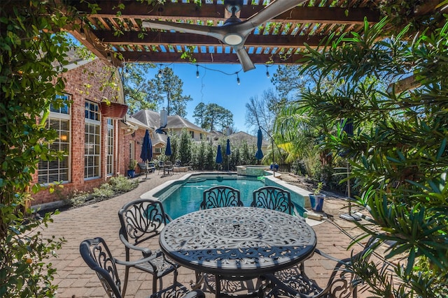 view of pool with a patio, a pergola, and a pool with connected hot tub