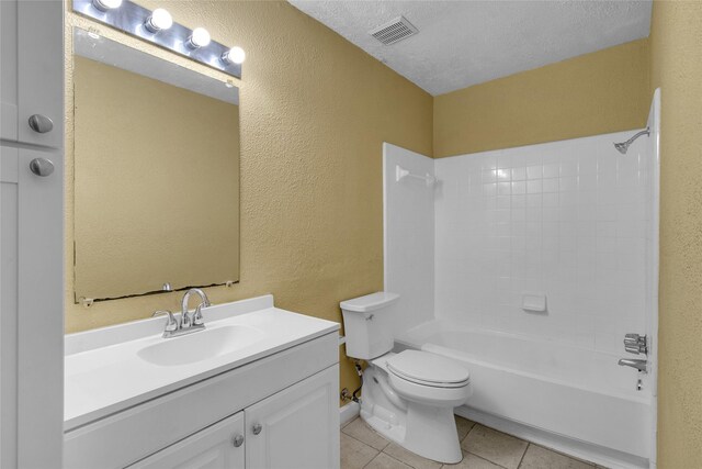 full bathroom featuring tile patterned flooring, visible vents, toilet, a textured wall, and a textured ceiling