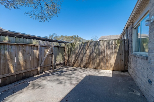 view of patio / terrace featuring fence