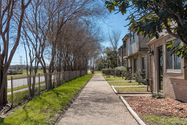 view of property's community with fence