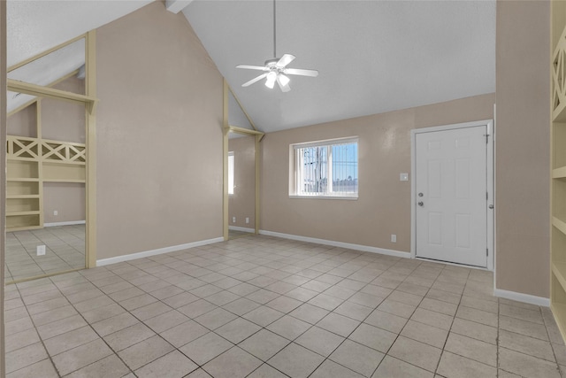 unfurnished living room with light tile patterned floors, high vaulted ceiling, baseboards, and a ceiling fan