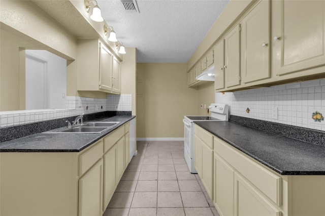 kitchen with light tile patterned floors, visible vents, a sink, electric stove, and dark countertops