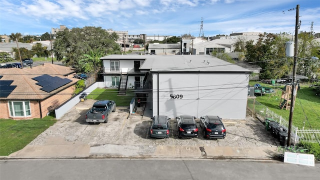5609 Leeland St Unit 8, Houston, TX 77023 - view of front of home with a front yard and fence