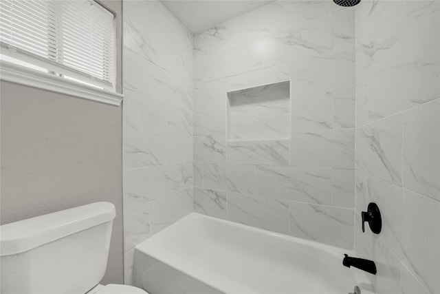 bathroom featuring toilet and shower / bathing tub combination