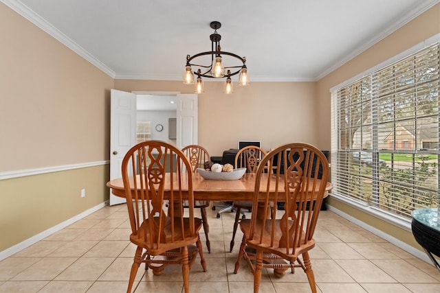 dining room with light tile patterned floors, baseboards, an inviting chandelier, and crown molding