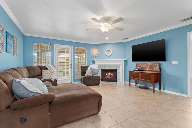 living area featuring baseboards, visible vents, and ornamental molding