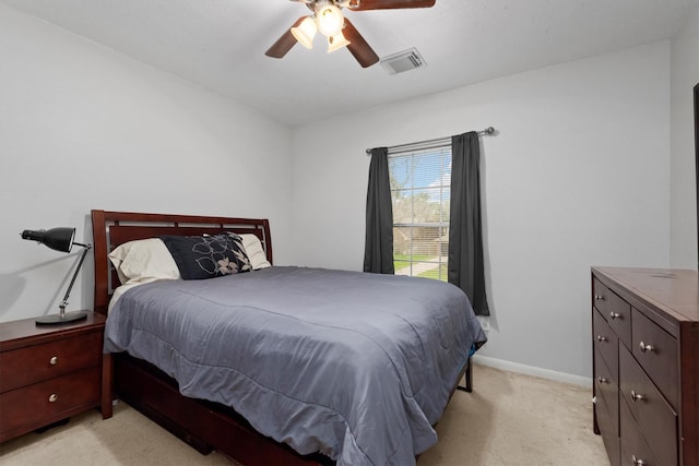 bedroom featuring light carpet, visible vents, ceiling fan, and baseboards