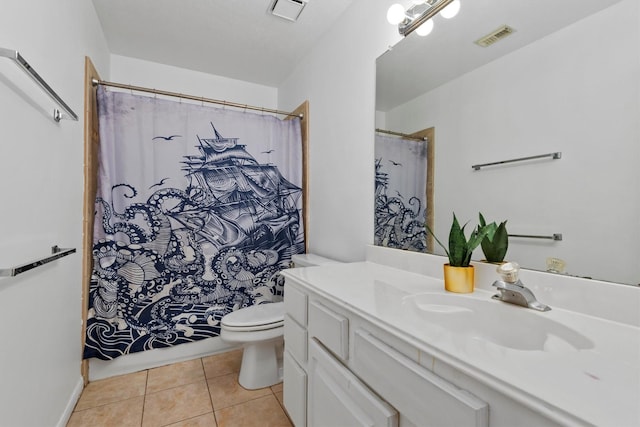 bathroom featuring visible vents, toilet, vanity, and tile patterned flooring