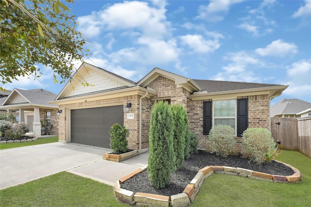 single story home featuring a garage, brick siding, driveway, and fence