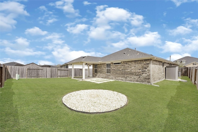 view of yard featuring a patio and a fenced backyard